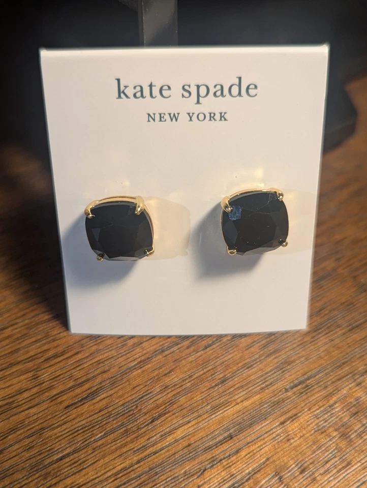 Aretes Kate Spade New York negros y dorados Foto 1 de 4
