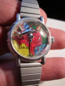 VINTAGE TALI WATCH AIRPLANE ROTATES AROUND DIAL BUBBLE CRYSTAL WIND UP - TK-4 - Picture 1 of 5