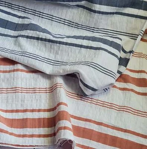 Yarn-dyed horizontal stripe seersucker cotton fabric. Blue/rust by the 1/2 metre - Picture 1 of 8