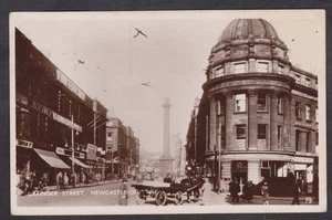1929 RPPC POSTCARD GRAINGER STREET MONUMENT & SHOPS ADVERTISING NEWCASTLE ONTYNE - Foto 1 di 2