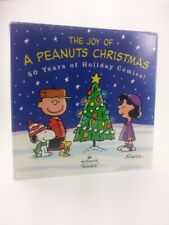 THE JOY OF A PEANUTS CHRISTMAS: 50 YEARS OF HOLIDAY By Charles M. Schulz *Mint*