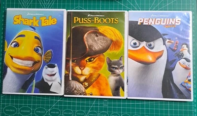 Lot of 3 DVDs: DreamWorks Animated Shark Tale, Puss in Boots, Penguins Foto 1 de 4