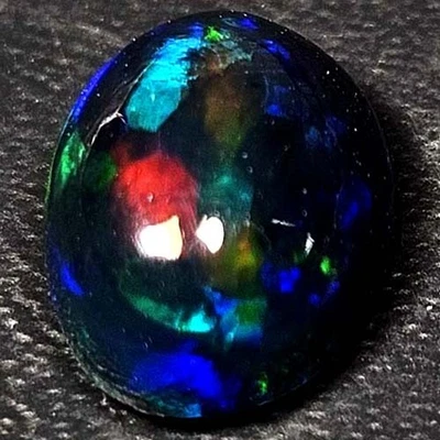 NATURAL AAA+VALUABLE COLOR PLAY OVAL CABOCHAN  ETHIOPIAN WELO BLACK OPAL 1.20CTS - Image 1 of 3