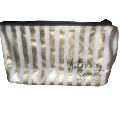 Bolsa de maquillaje cosmético Victoria's Secret a rayas doradas y blancas Foto 1 de 3
