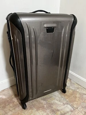 Maleta de traje de viaje de 4 ruedas Tumi Vapor usada para facturar equipaje - marrón champán Foto 1 de 4