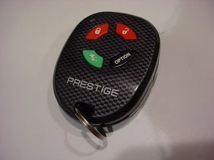 nice,working 4-button PRESTIGE Key Fob Remote APS2K4MSFLCF FCC ELVATCB w/light - Picture 1 of 4