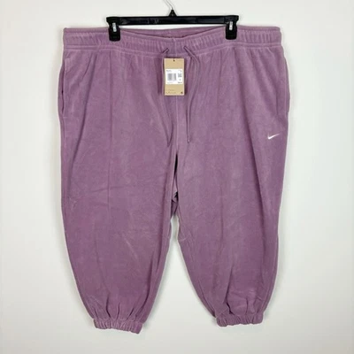 Женские свободные флисовые брюки Nike Therma-FIT фиолетового цвета большого размера - Изображение 1 из 4