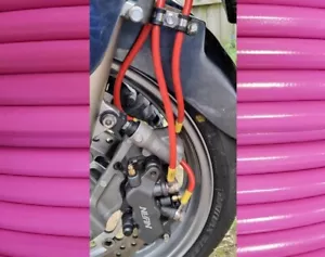 PINK ST1300 ABS FRONT HEL BRAIDED BRAKE HOSES - Picture 1 of 9