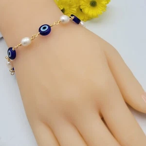Pulsera con cuentas de mal de ojo azul chapada en oro de 18 K. Amuleto. Laminado dorado - Imagen 1 de 6