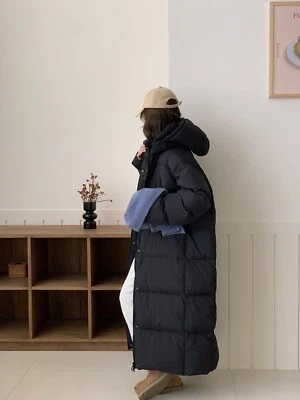 Chaqueta acolchada larga negra cálida para invierno, con cuatro cómodos bolsillos  Foto 1 de 2