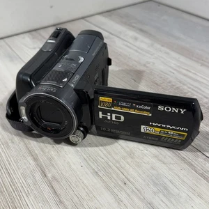 Videocámara digital de alta visión Sony HDR-SR12 Handycam repuestos o reparaciones (LEER) - Imagen 1 de 8