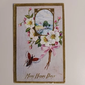 Many Happy Days Greeting Postcard Embossed Flowers Posted Coastline Scene - Picture 1 of 9