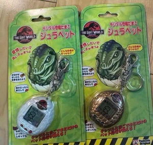 Tamagotchi Jura Pet White Gold Set of 2 Jurassic Park Lost World Bandai Japan - Picture 1 of 2