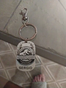 Universal Studios Jurassic World T-Rex Dinosaur Metal Keychain Name Sergio - Picture 1 of 5