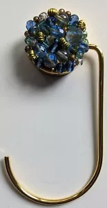 Soporte para bolsa CERUTTI INOX ""Mimí Precioso Celeste"" - enchapado en oro - cristales azules - Imagen 1 de 6