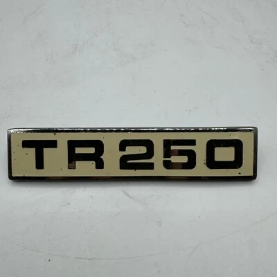 Insignia maletero original Stanpart Triumph Triumph Cloisonne y cromo "TR 250" 622262 Foto 1 de 4