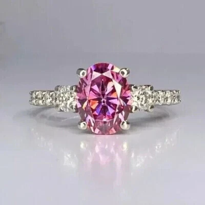 Anillo de boda para mujer de 2 quilates ovalado simulado con zafiro rosa enchapado en oro blanco de 14 quilates Foto 1 de 4