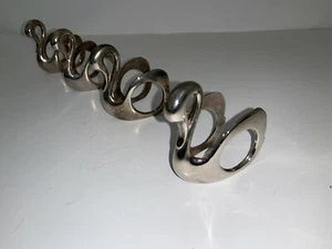 LOTE DE 4 servilleteros SWAN de metal tono plata MEDIDAS: 2 1/2" de alto X 2 1/4" - Imagen 1 de 10