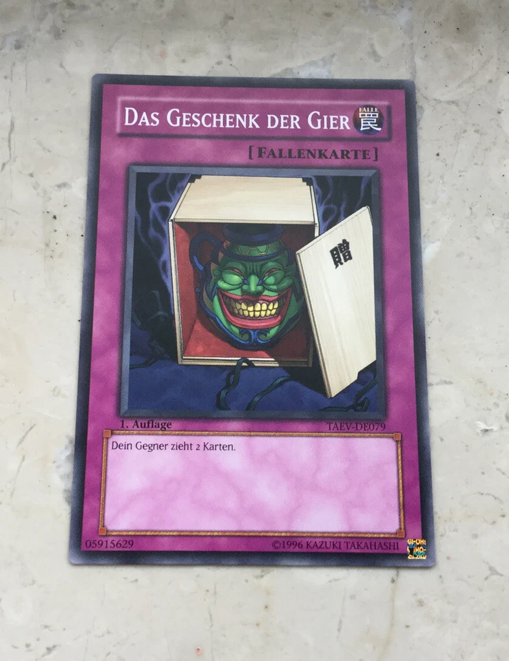 Yu-Gi-Oh DAS GESCHENK DER GIER, TAEV-DE079, 1. Auflage - Bild 1 von 1