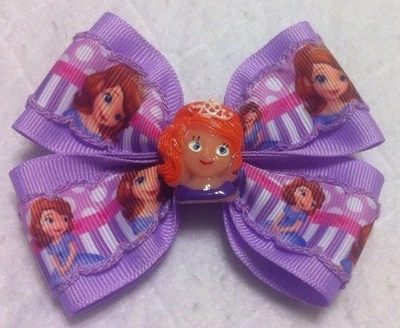 Moño de pelo para niñas de 4" de ancho Sofía la primera cinta púrpura grosgrain clip de cocodrilo Foto 1 de 4