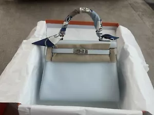 HERMÈS Kelly 25 cm Retourne Handbag in Bleu Brume Swift leather, Full Set - Bild 1 von 24