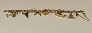 Vintage MONET CHARM BRACELET Airplane Baby Booties Xmas Tree Guns Gold Stunning! - Picture 1 of 19