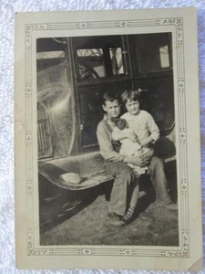Antique A Boy And A Girl With Her Doll Sitting On The Running Board Photograph - Picture 1 of 3