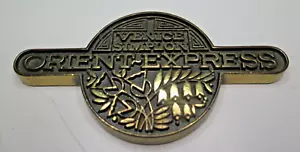VENICE SIMPLON ORIENT EXPRESS MASSIVMESSING ABZEICHEN EMBLEM PAPIERGEWICHT FILZUNTERLAGE - Bild 1 von 10