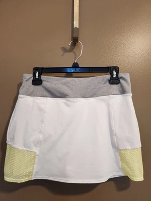 Falda de tenis para mujer Reebok talla mediana blanca amarilla y gris detalles 30" x 13" Foto 1 de 4
