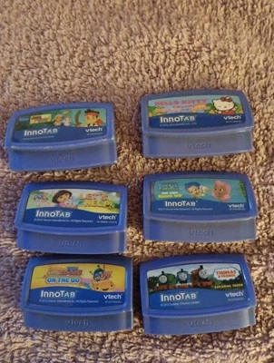 Vtech 6 cartridge lot, hello kitty ,dora,thomas the train, - Image 1 of 4