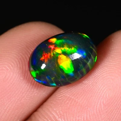 Cabujón ovalado ópalo negro multi fuego etíope natural piedra preciosa suelta 7x5 mm AAA Foto 1 de 4