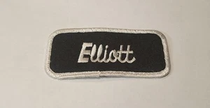 ElLLLIOTT USED EMBROIDERED SEW ON NAME PATCH TAGS WHITE ON BLACK - Picture 1 of 2