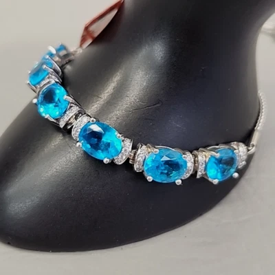 Pulsera Deslizante Diamantes de Imitación Azul Vidrio Ovalado Tono Plata JTV Foto 1 de 4