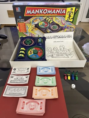 MB Spiel   MANKOMANIA Wie verjubelt man eine Million  Brettspiel von 1997 - Bild 1 von 4