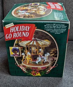 MR. CHRISTMAS SEARS HOLIDAY GO ROUND 1996 CARRUSEL ANIMADO CON CANCIONES - Imagen 1 de 1