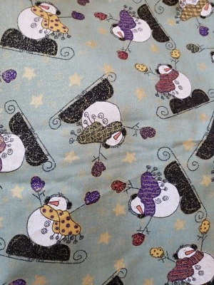 SEWING FABRIC Ice Skating Snowmen Big Feet Scarf Green Glitter 1ydX45" Cotton - Image 1 of 3