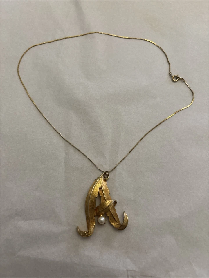 Collana vintage americana firmata Nolan Miller Oro con smalto rosso e decorazion - Immagine 1 di 4