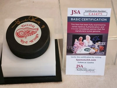 GORDIE HOWE signed RED WINGS puck JSA COA - Image 1 of 2