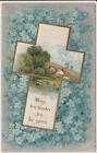 Pocztówka wielkanocna vintage: Krzyż wielkanocny na polu niebieskich kwiatów - ok. 1910