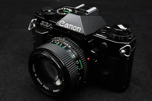 【TOP IDEALNY】 Canon AE-1 PROGRAM BLack 35mm Lustrzanka Kamera Nowa FD 50mm f/1.4 Japonia - Zdjęcie 1 z 21