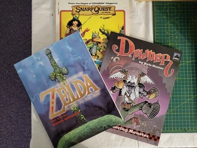 3 Graphic Novels: Snarf Quest, Zelda and Downer - Dungeons & Dragons interest - Image 1 of 4