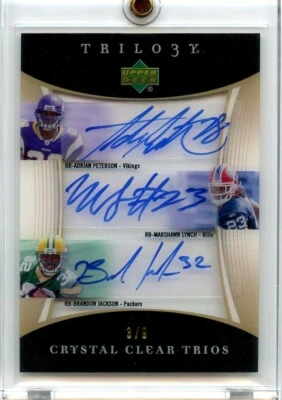 Adrian Peterson / Marshawn Lynch 2007 UD Trilogy Crystal Clear Trios Auto /9 RC  - Image 1 of 2