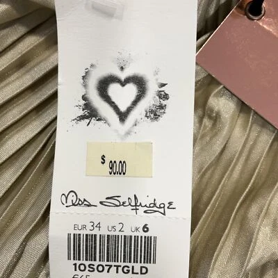 Maxi falda diseñada por Miss Selfridge para mujer talla 2 plisada dorada cintura elástica Foto 1 de 4