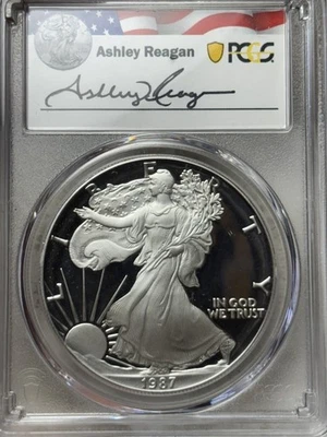 1987-S Proof $1 PCGS PR-70 DCAM 1oz American Silver Eagle Ashley Reagan Signed - Image 1 of 4