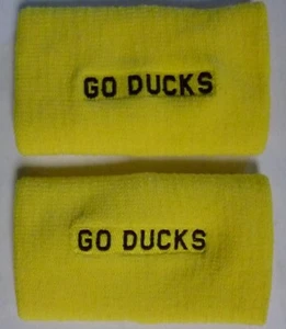 OREGON DUCKS Nike Doublewide Wristbands GO DUCKS Yellow/Black Swoosh sweatband - Picture 1 of 2