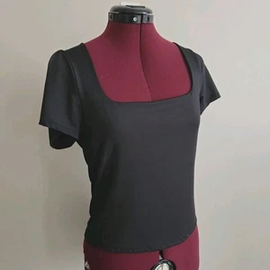 Free People Damen Clean Lines Sunfade Baby T-Shirt Oberteil schwarz Kurzarm Large  - Bild 1 von 5