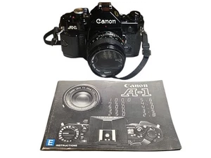 Canon A-1 Black 35mm Camera W/ FD 50mm Lens And Instruction Book - Untested - Picture 1 of 9