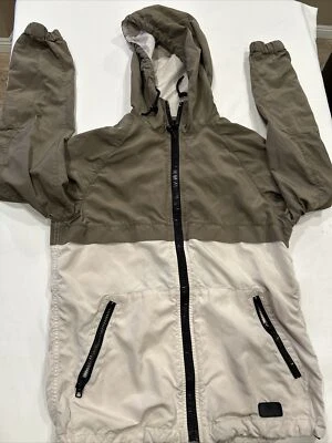 Chaqueta cortavientos Coach XS para mujer color tostado y beige con capucha precio de venta sugerido por el fabricante 450 USD Foto 1 de 4