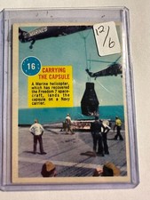 K117,437 - 1963 Topps Astronauts #16 Carrying the Capsule