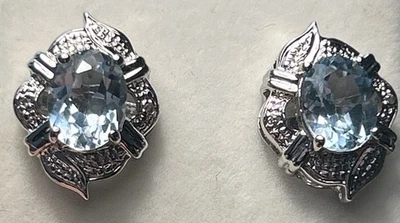 Elegant Rhodium Plated Genuine Blue Topaz & CZ Stud Earrings Oval, New In Box - Image 1 of 4
